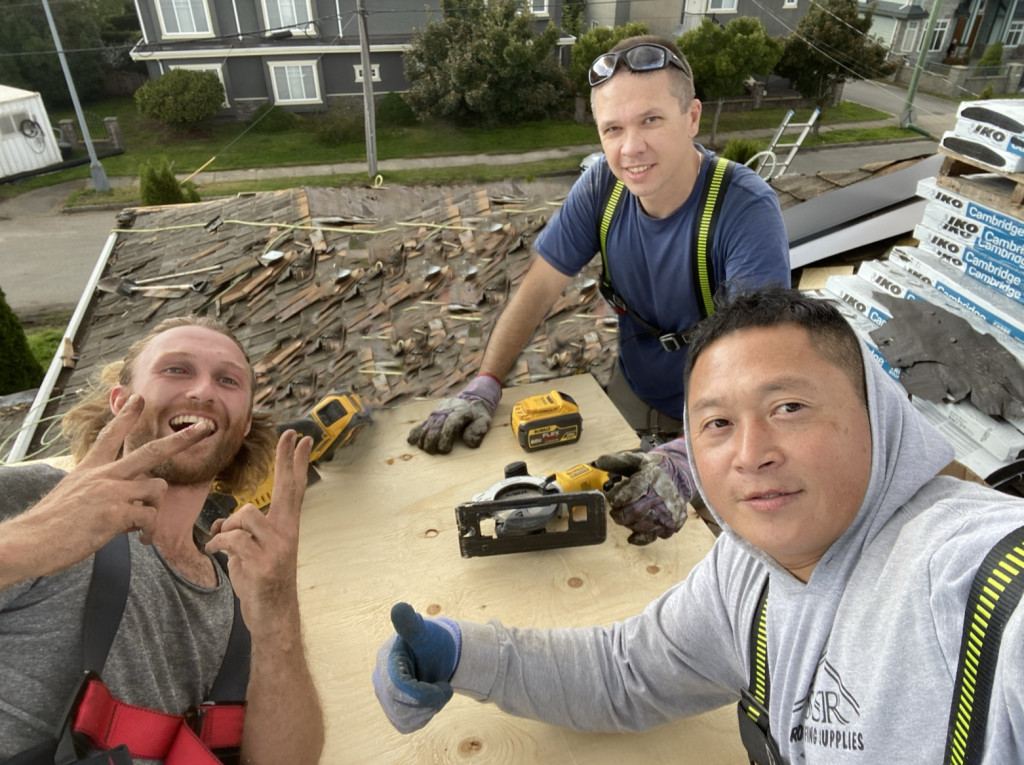 ABC Roof Service team on a roof